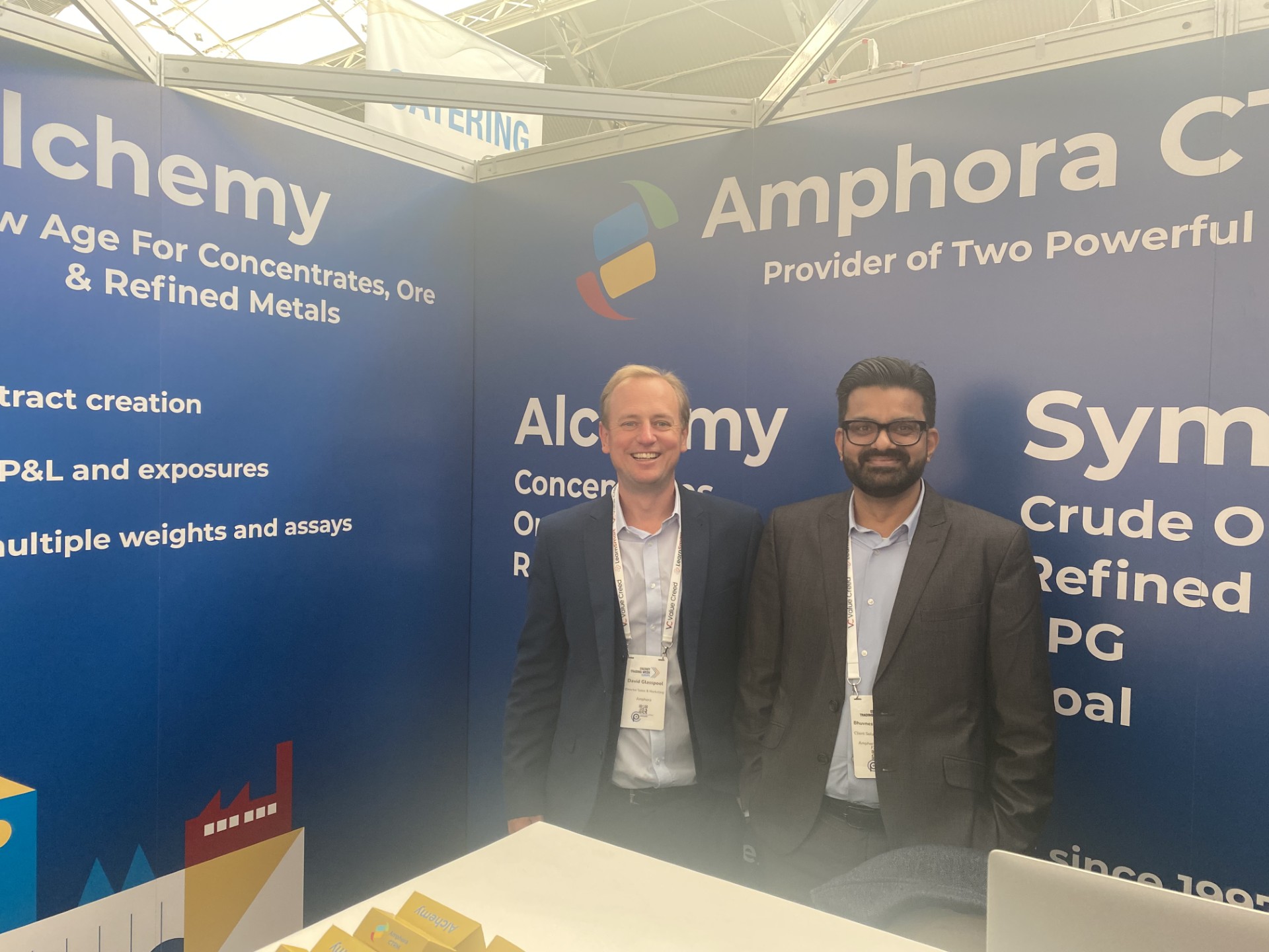 David Glasspool and Bhuvnesh Saraswat in front of the Amphora CTRM banner